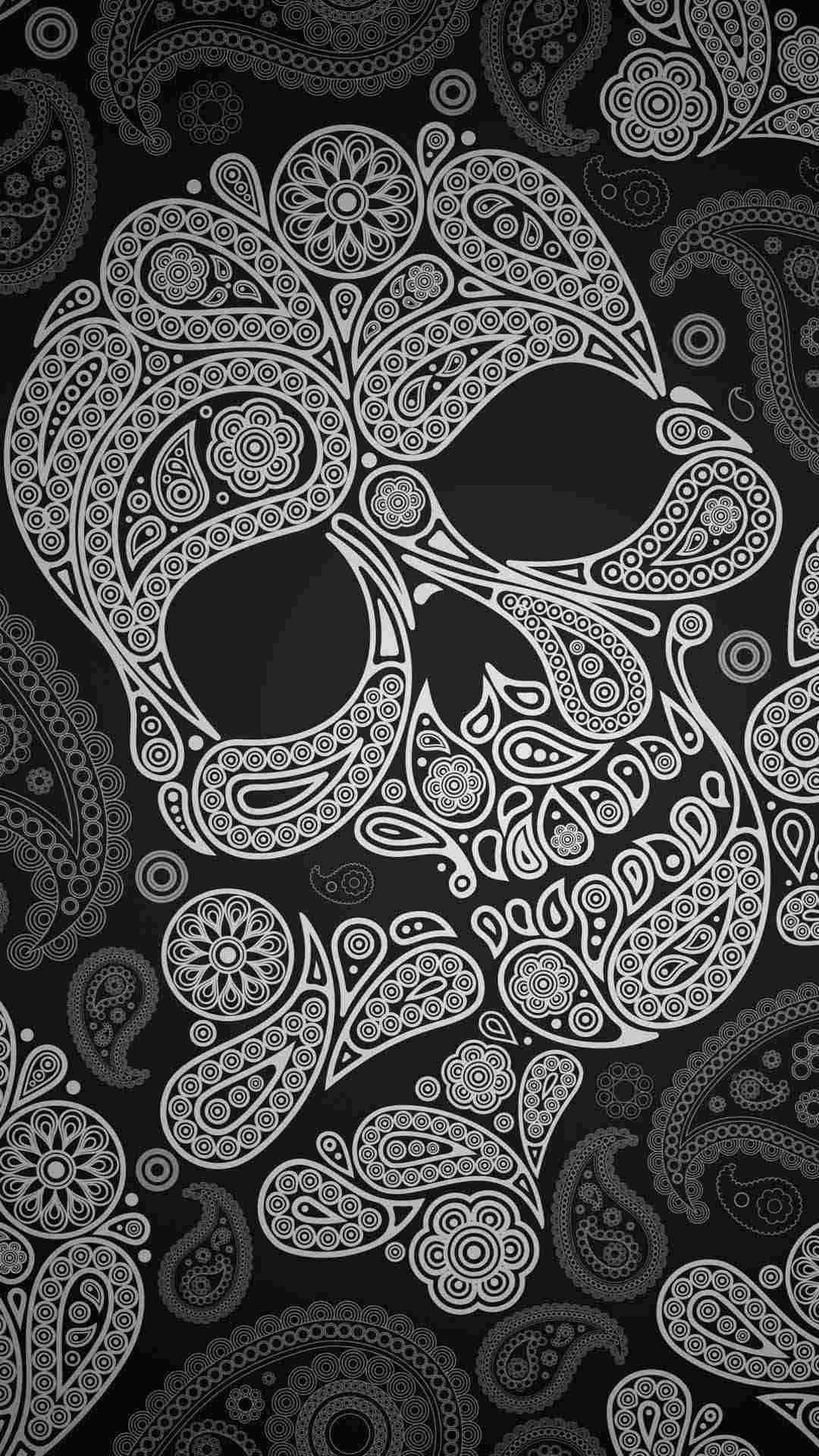 A Black And White Skull With Paisley Pattern Background