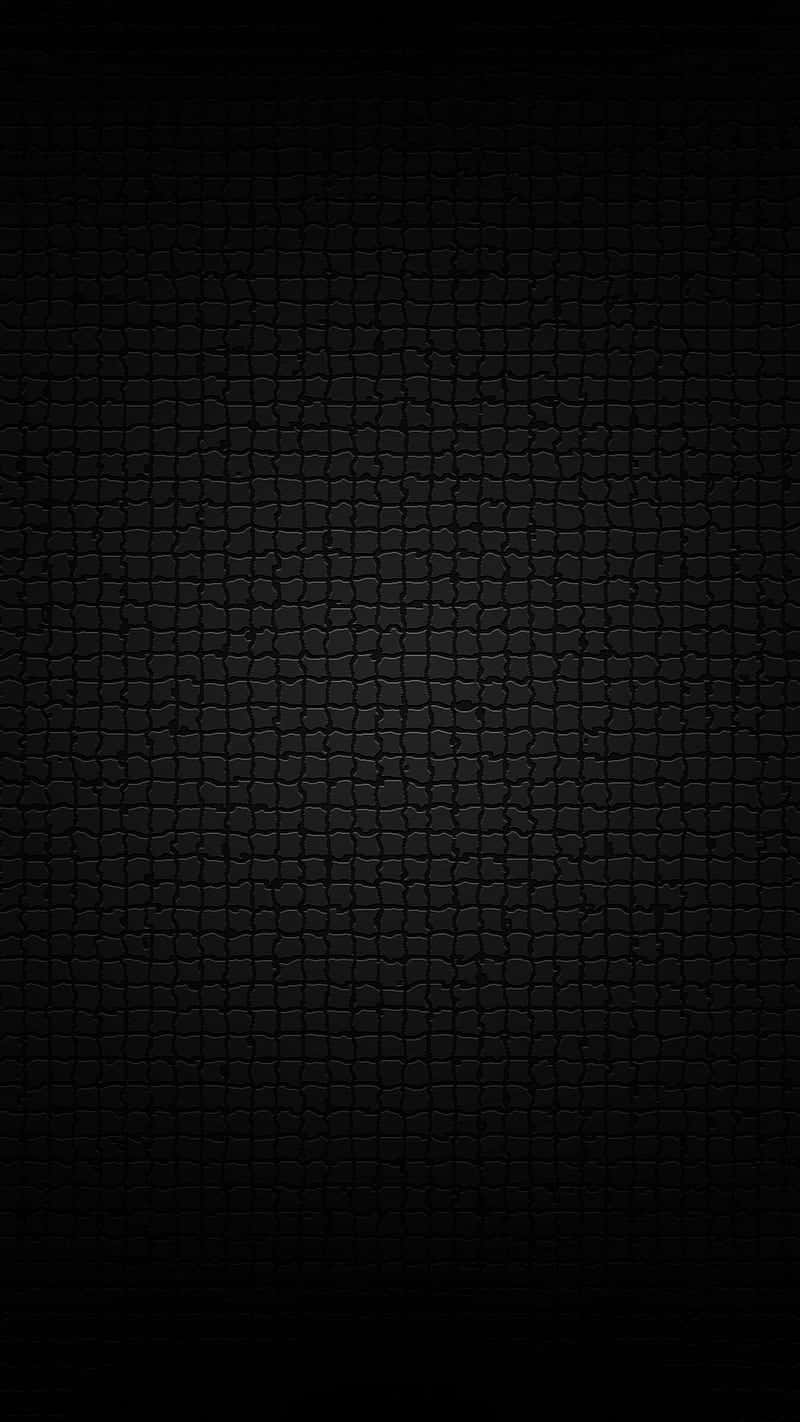 A Black Background With A Brick Pattern