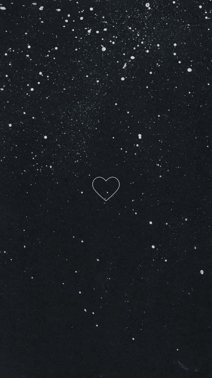 A Black Background With A Heart In The Sky Background