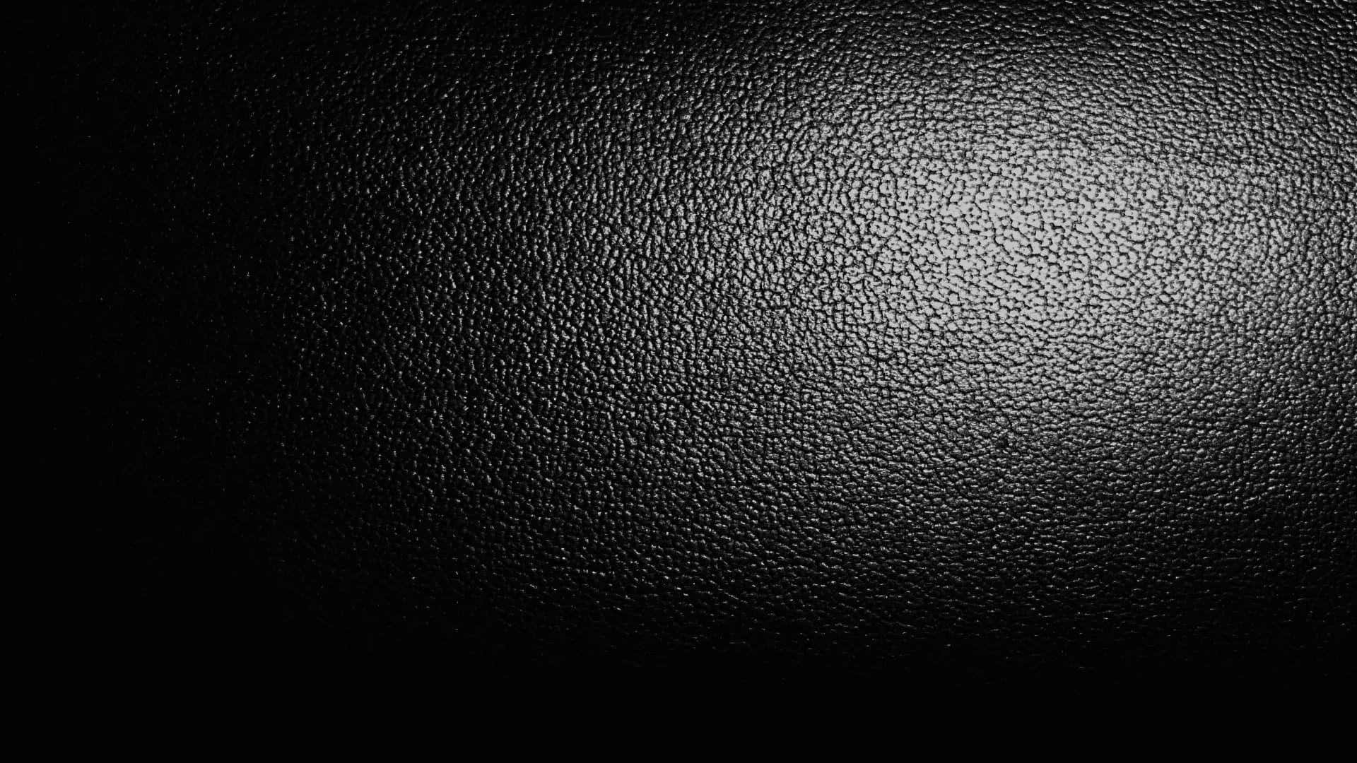 A Black Background With A Light Shining On It Background