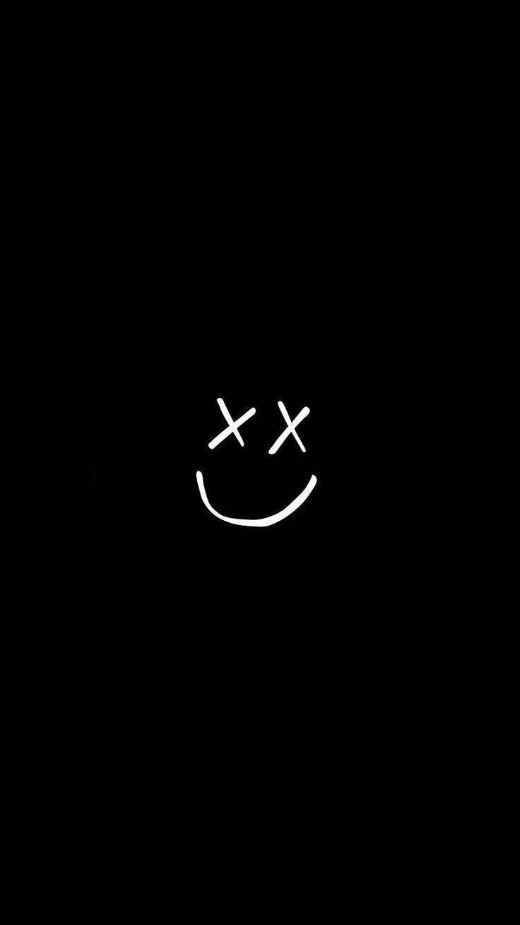 A Black Background With A White Smiley Face