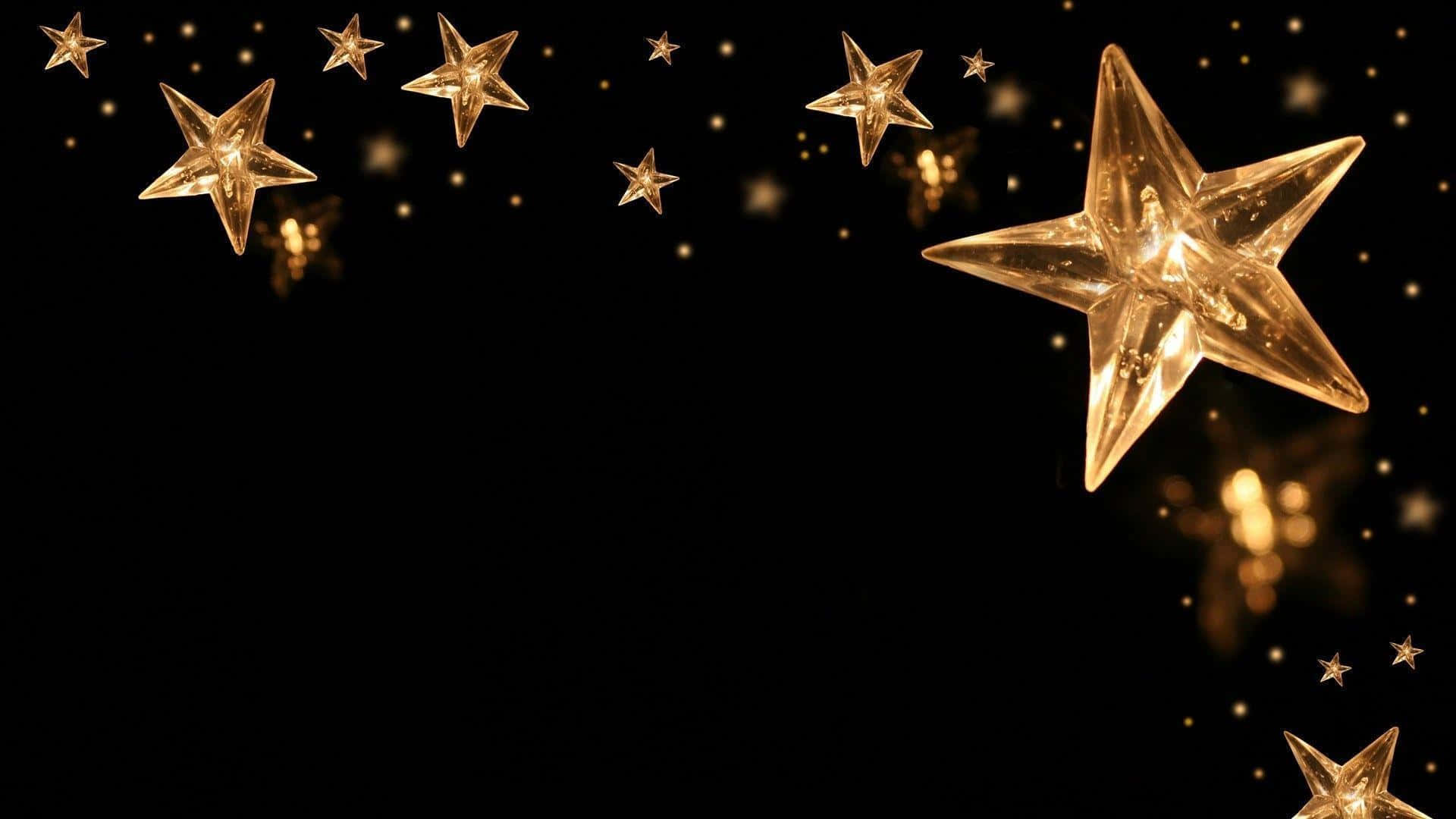 A Black Background With Gold Stars On It Background