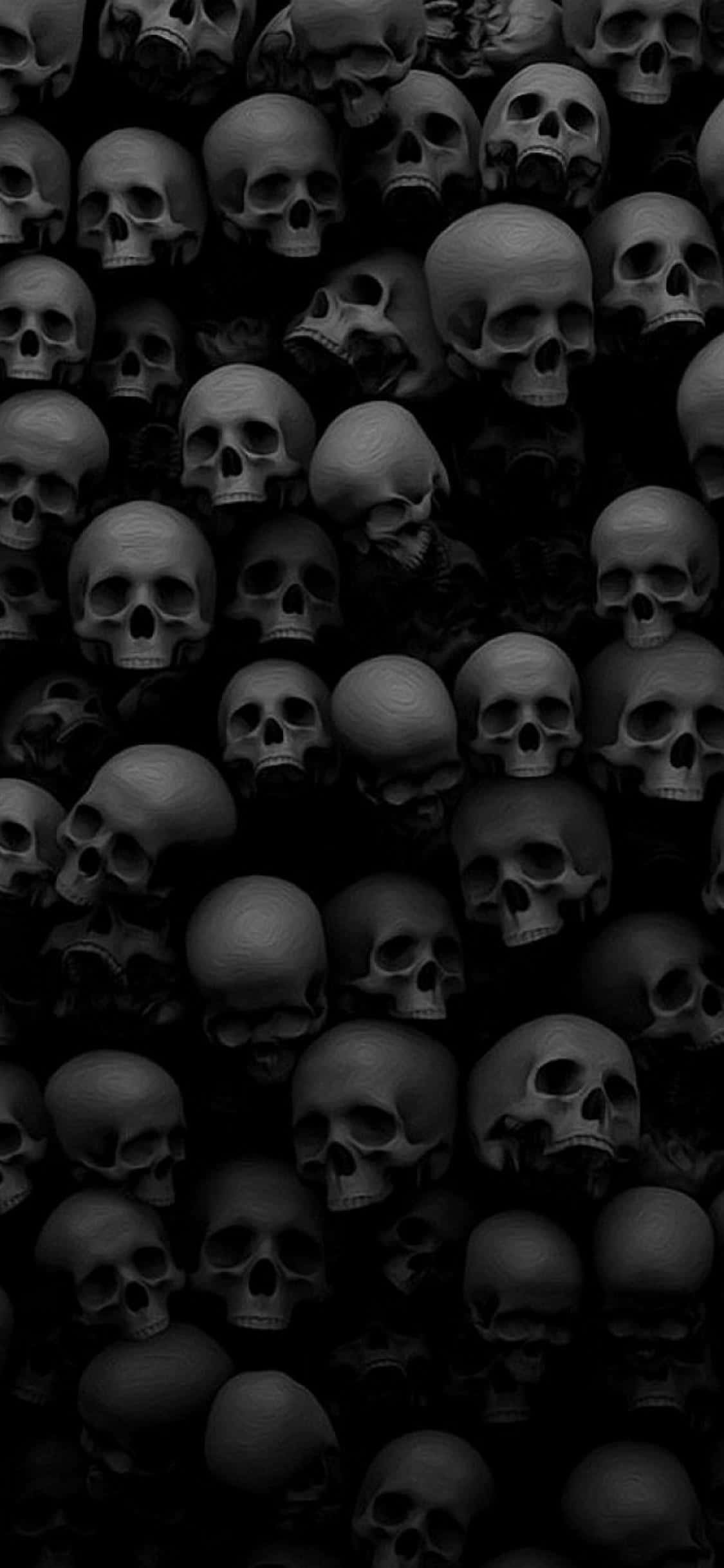 A Black Background With Many Skulls In It Background