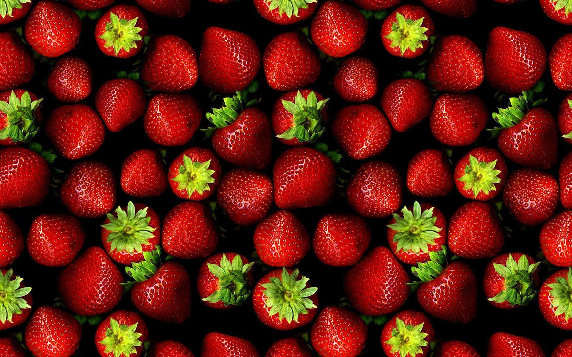 A Black Background With Many Strawberries Background