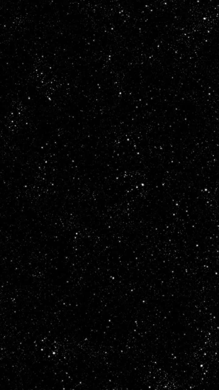 A Black Background With Stars On It