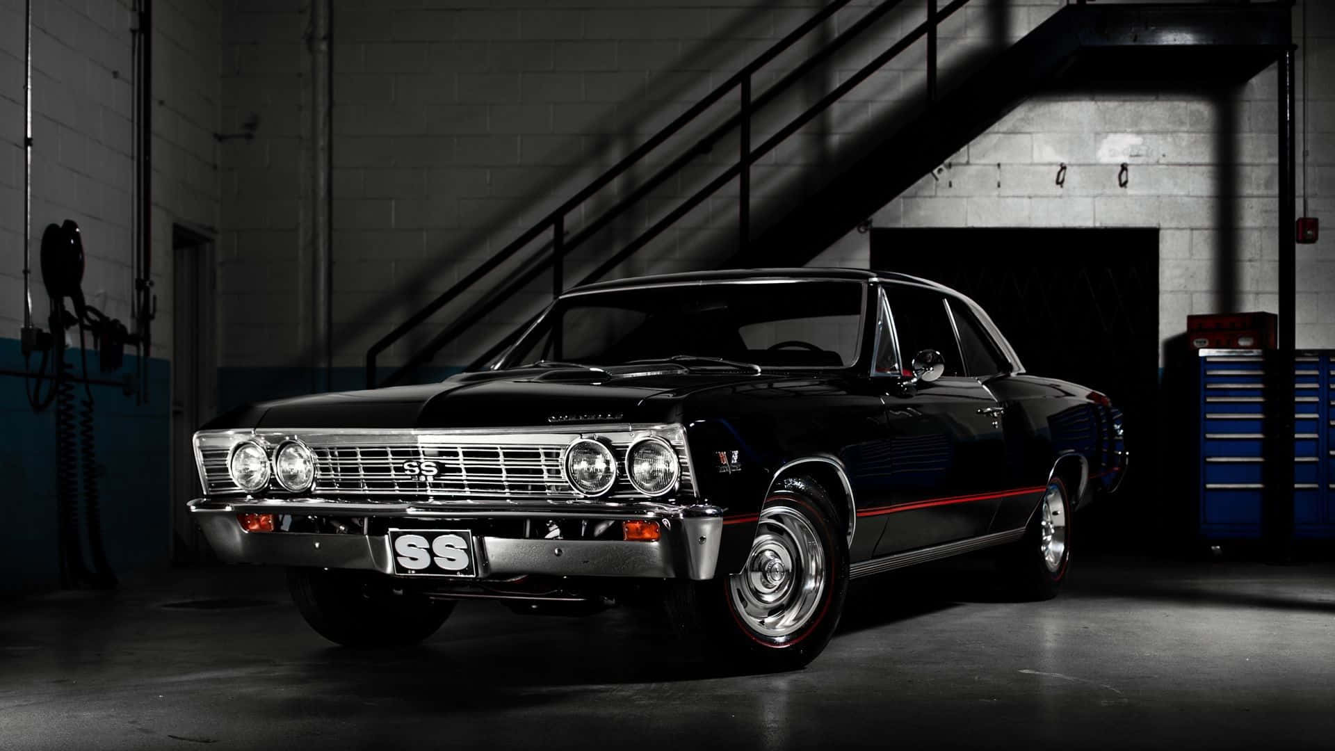 A Black Car Is Parked In A Dark Room Background