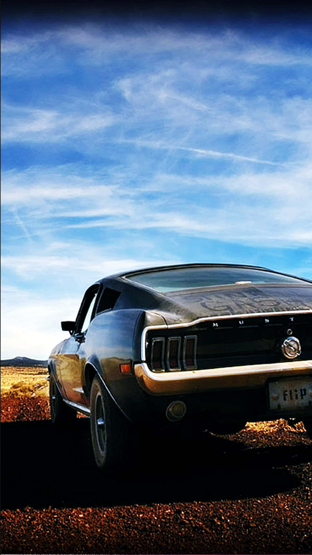 A Black Car Parked On A Dirt Road