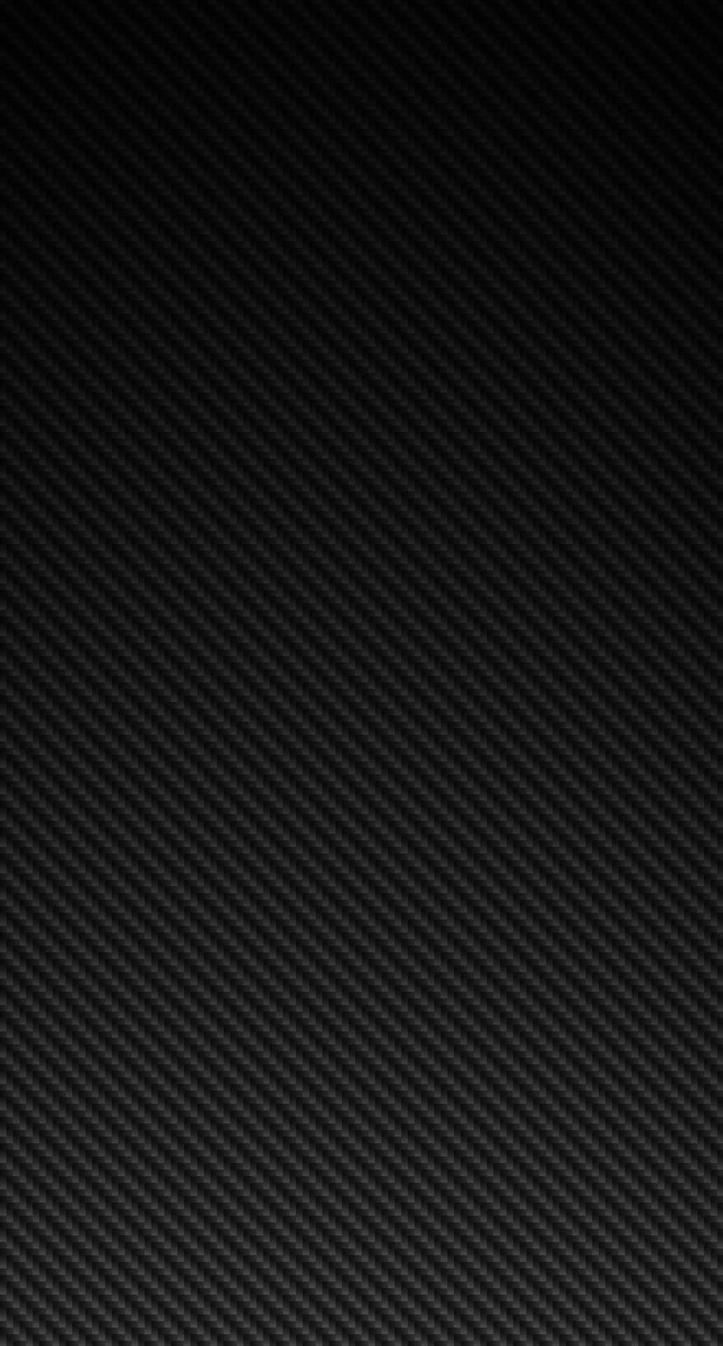 A Black Carbon Fiber Background With A Black Background Background