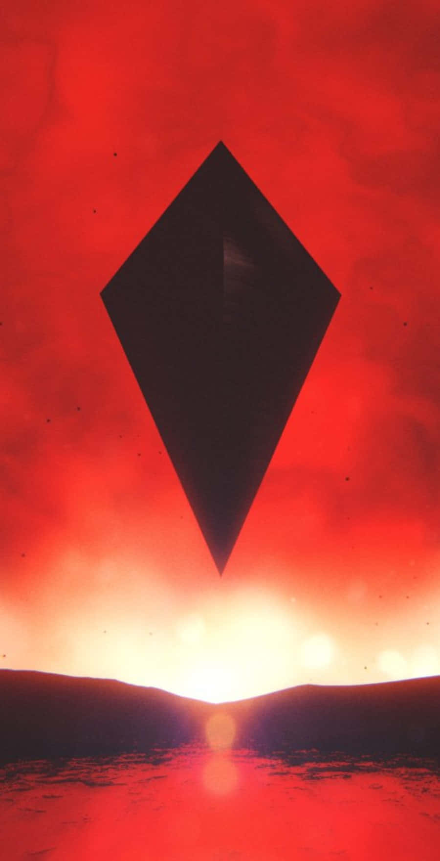 A Black Diamond In The Sky With A Red Sunset Background