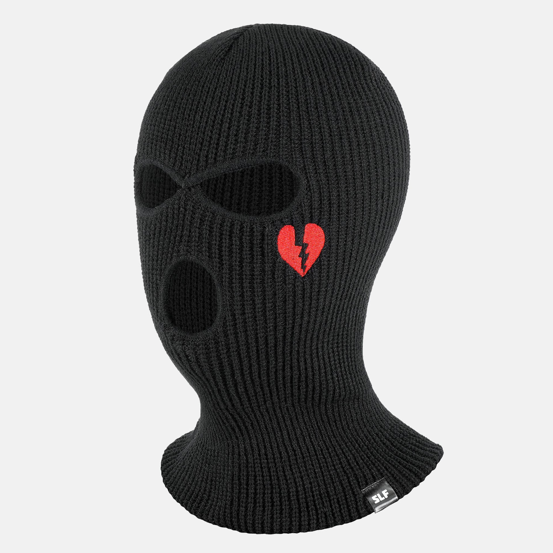 A Black Knitted Mask With A Heart On It Background