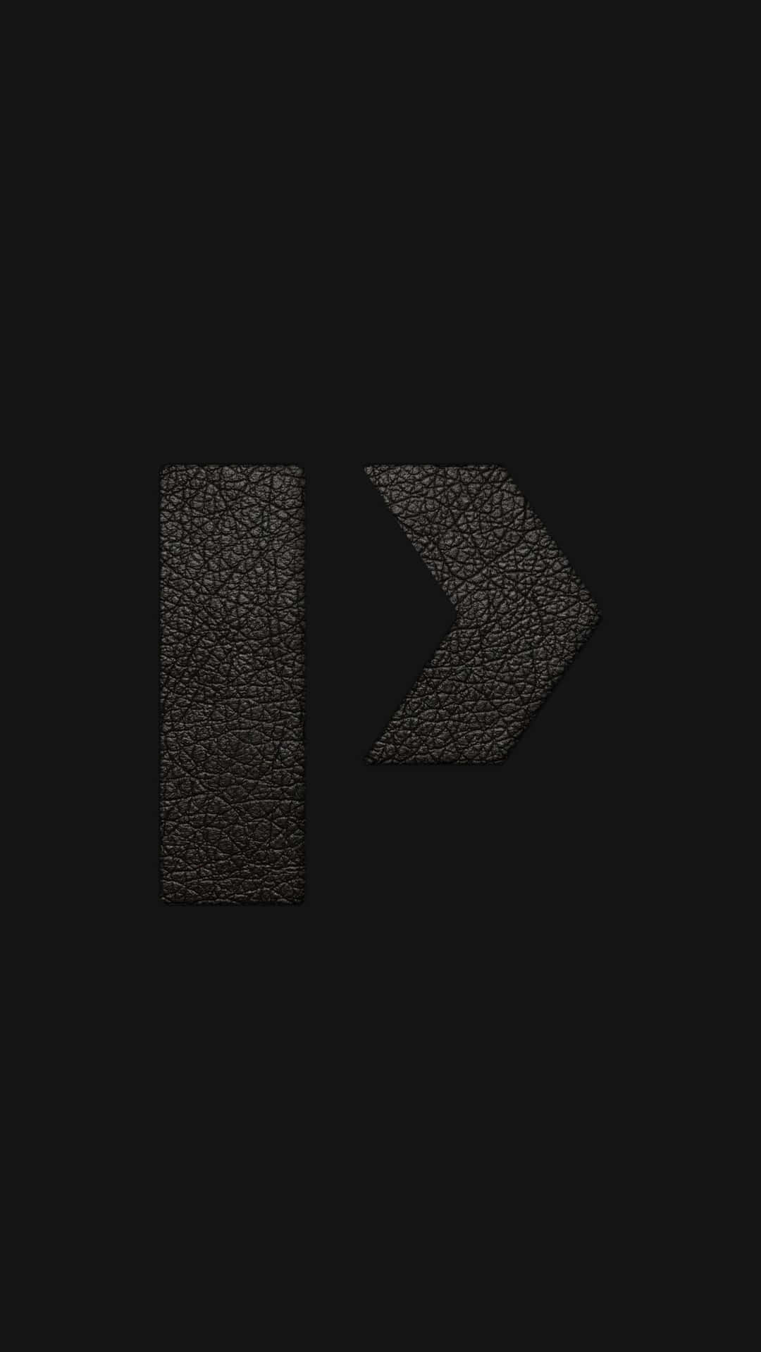 A Black Leather Arrow On A Black Background Background