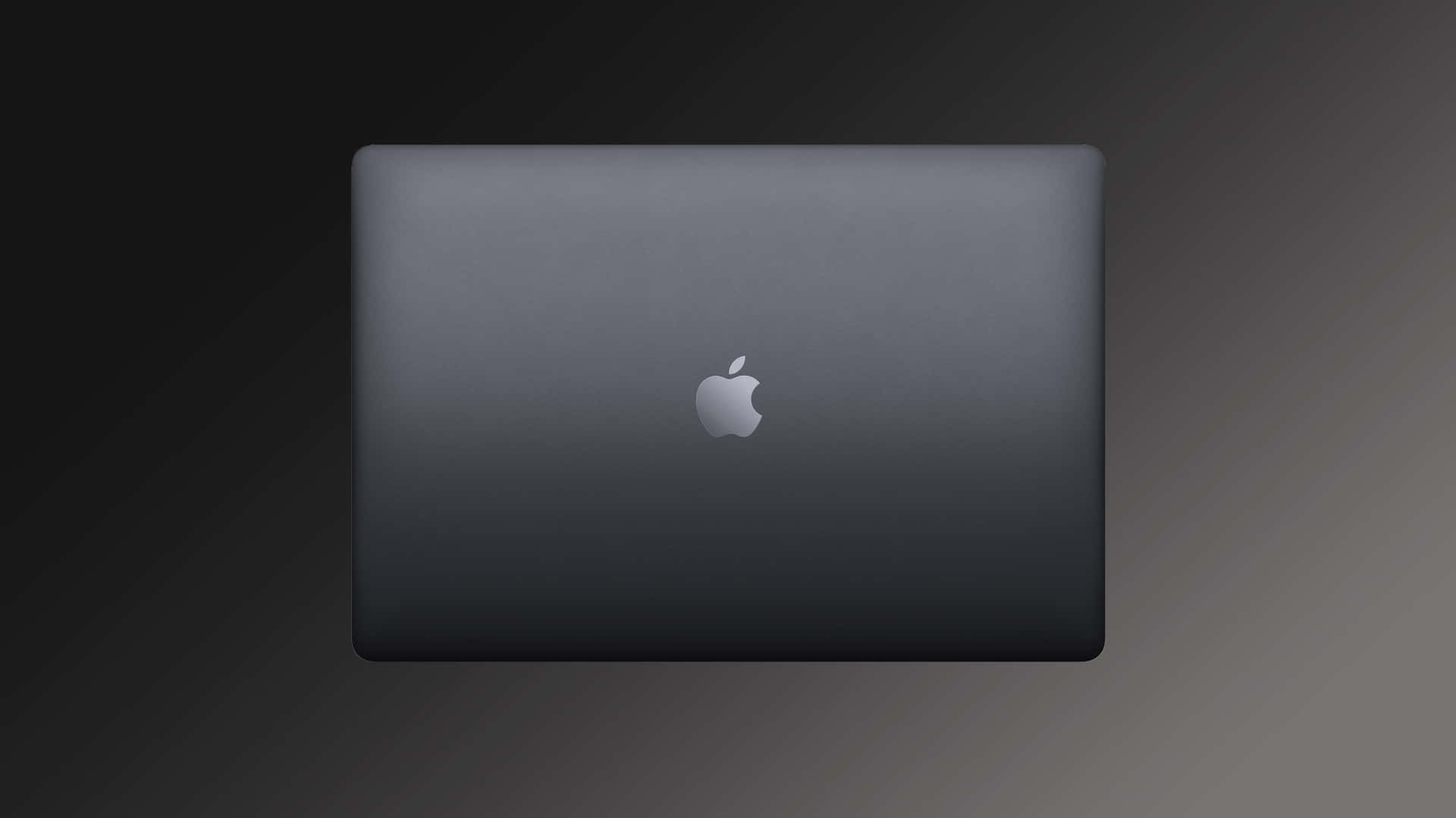 A Black Macbook Pro With A Logo On It Background