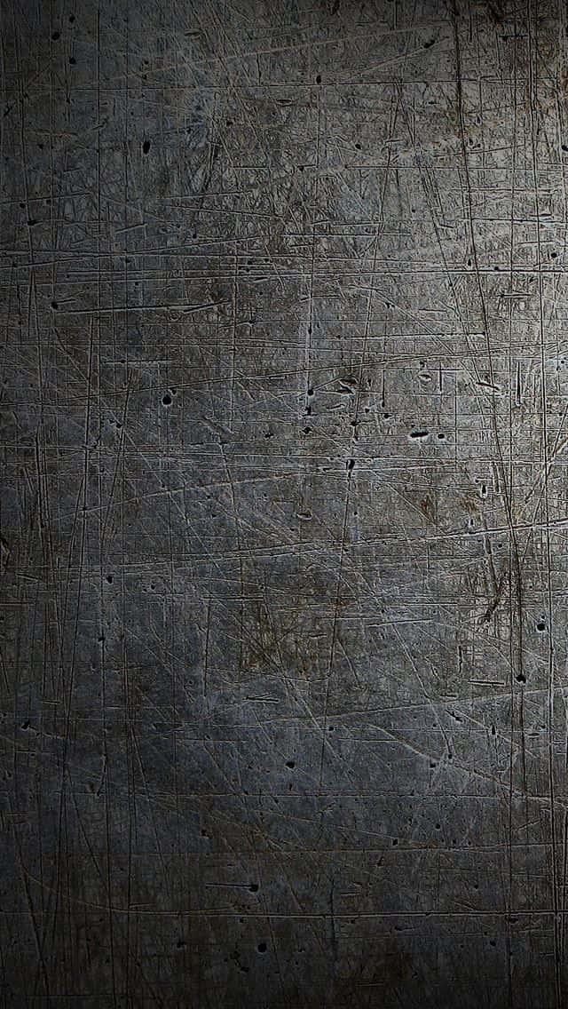 A Black Metal Background With A Light Shining On It