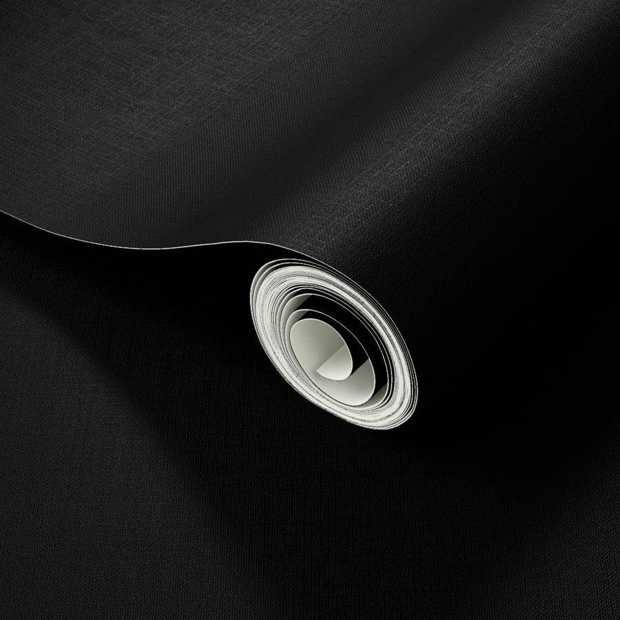 A Black Roll Of Paper On A Surface Background