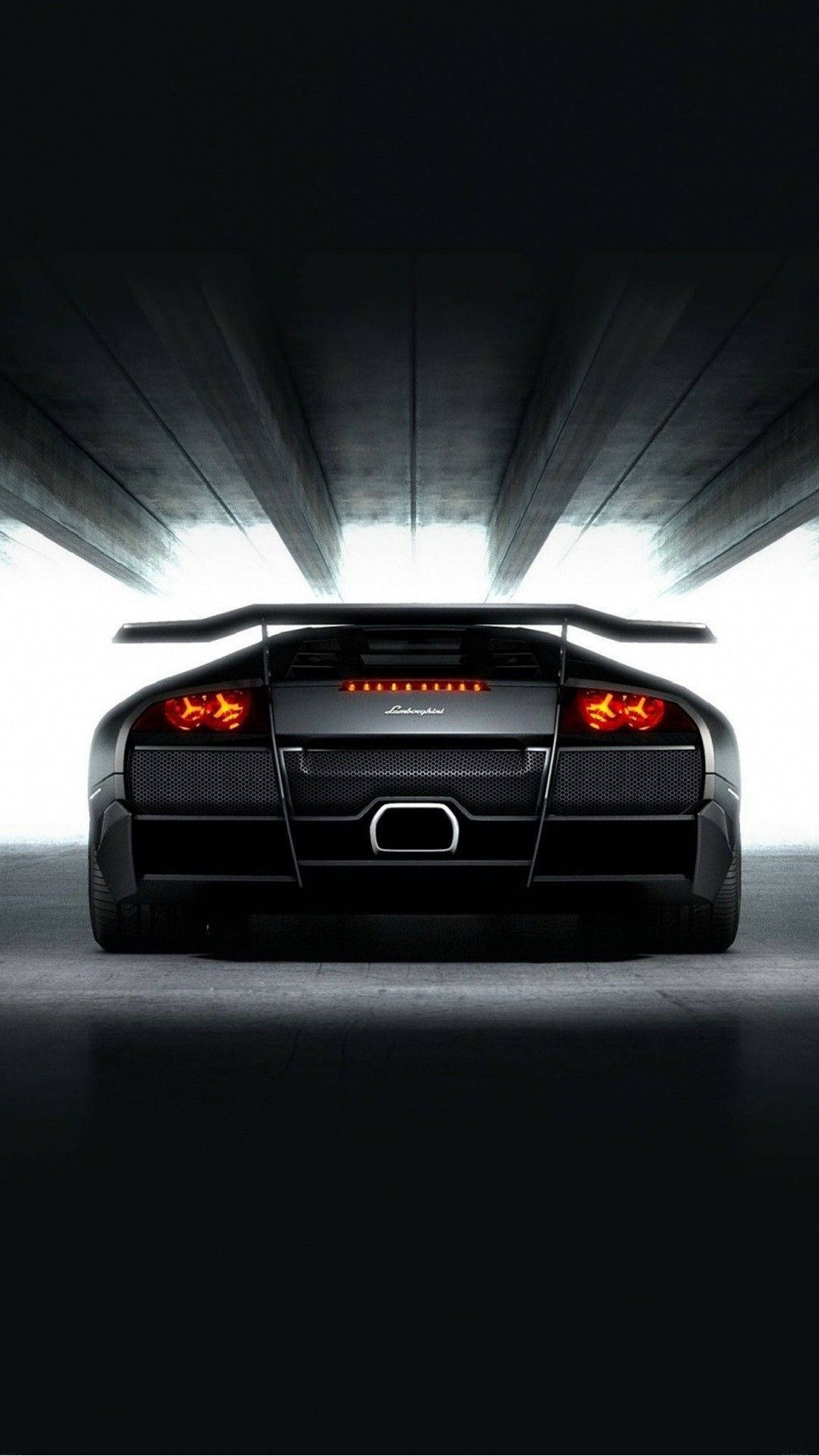 A Black Sports Car In A Dark Tunnel Background