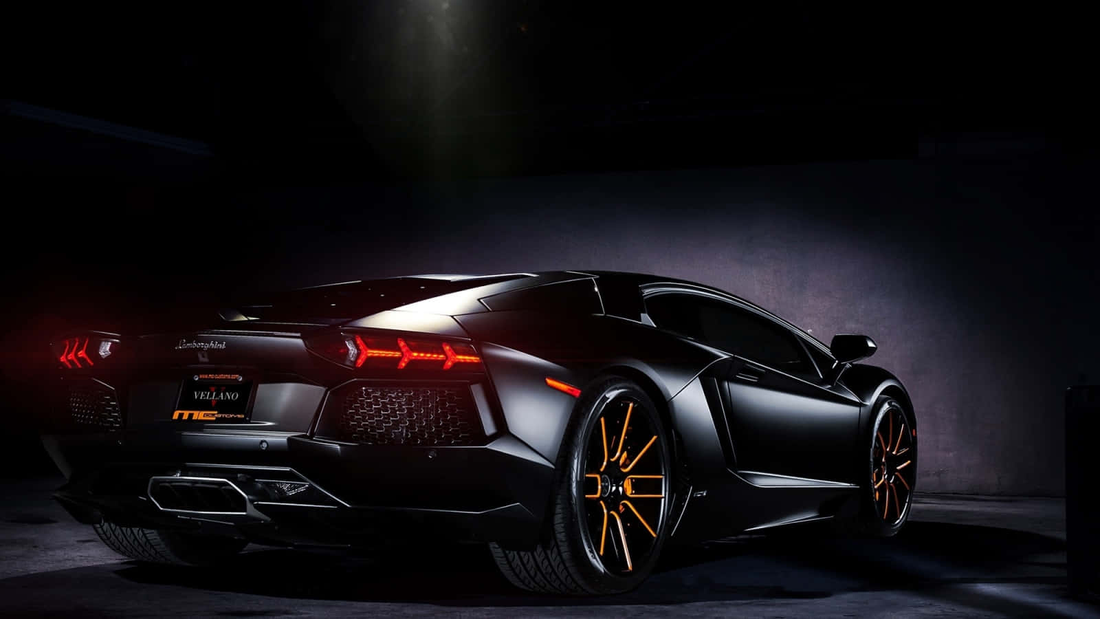 A Black Sports Car Is Parked In A Dark Room Background