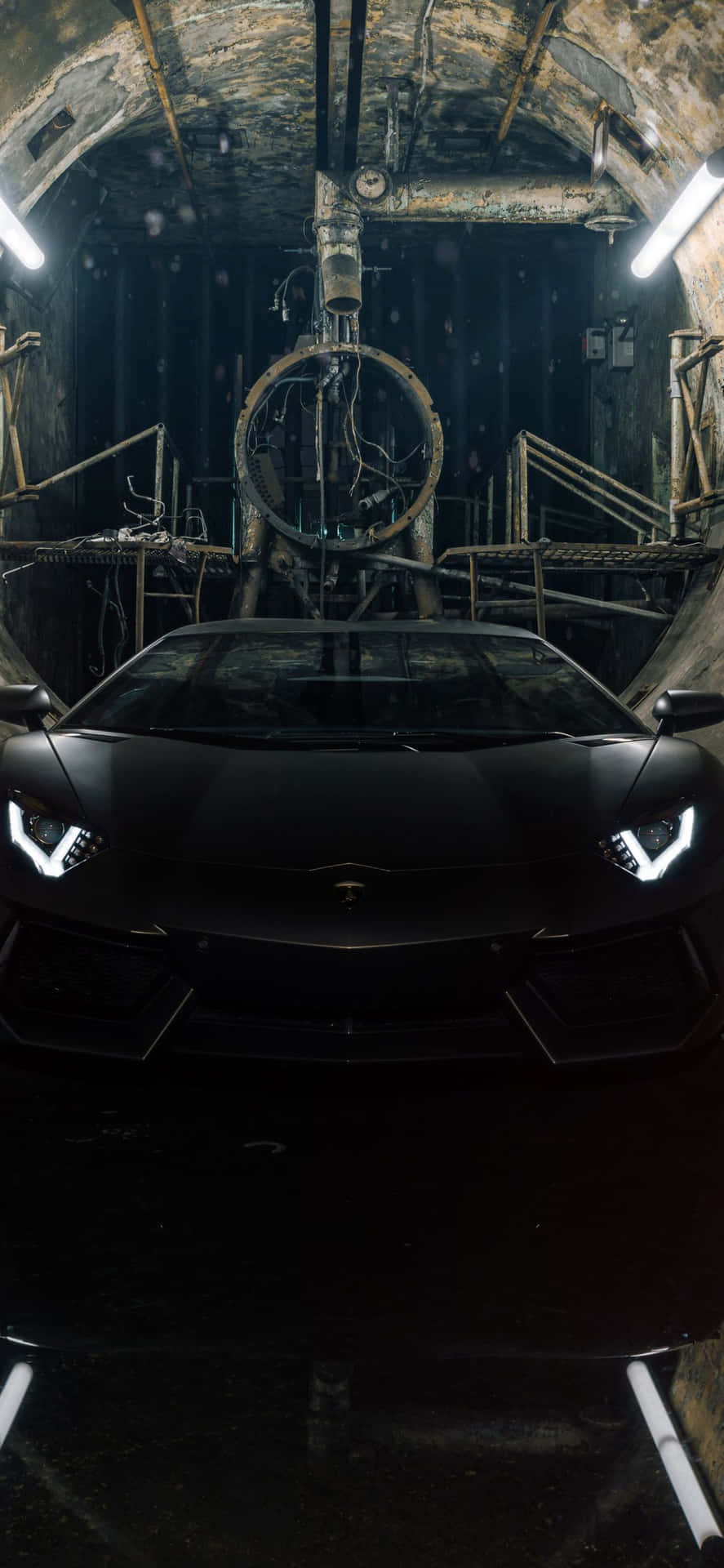 A Black Sports Car Is Parked In A Dark Tunnel Background