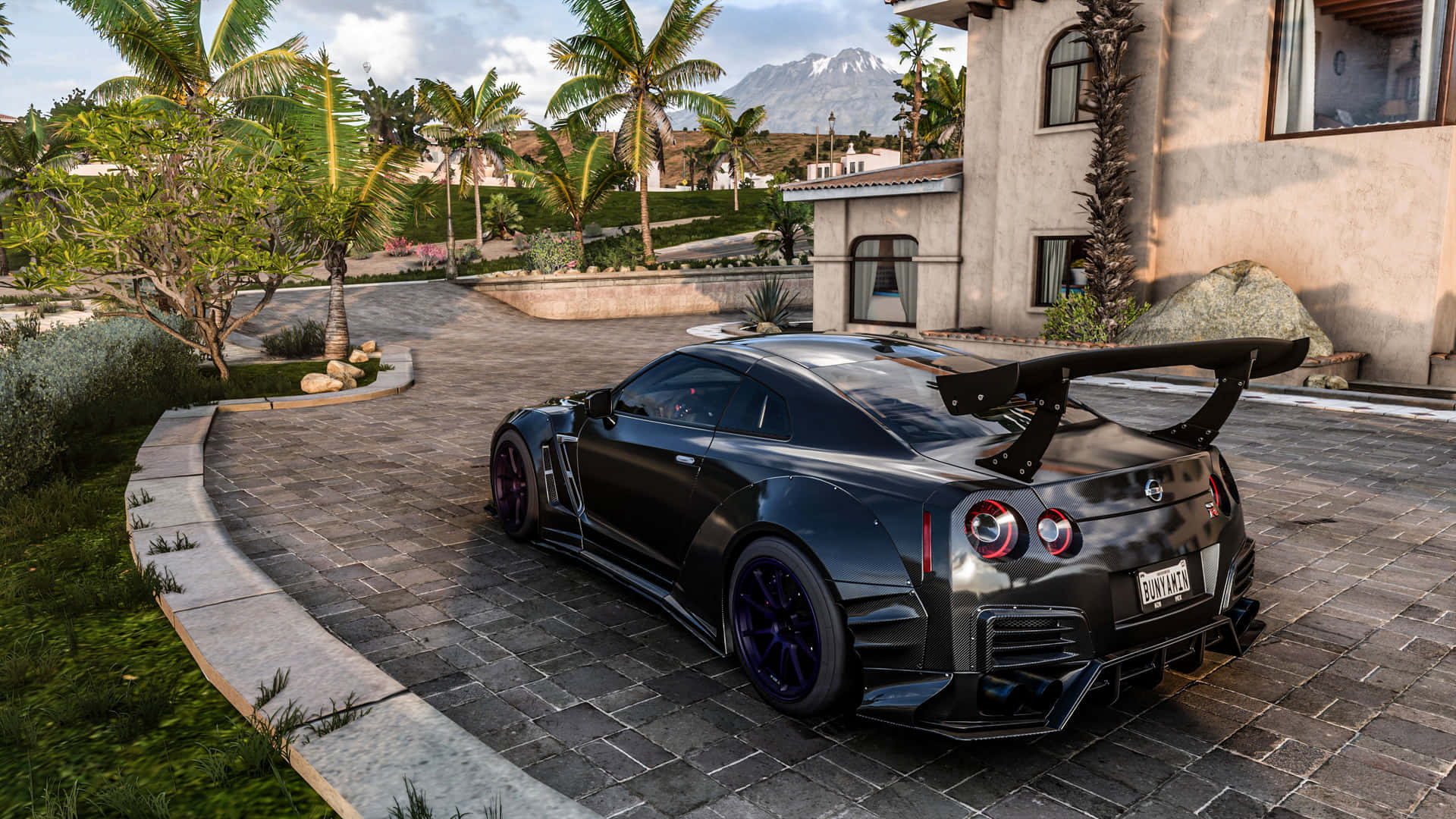 A Black Sports Car Parked On A Driveway Background