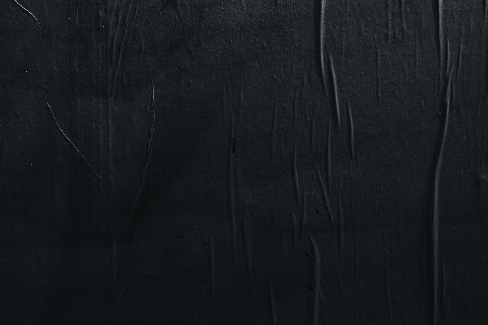 A Black Wall With A Black Paint Background