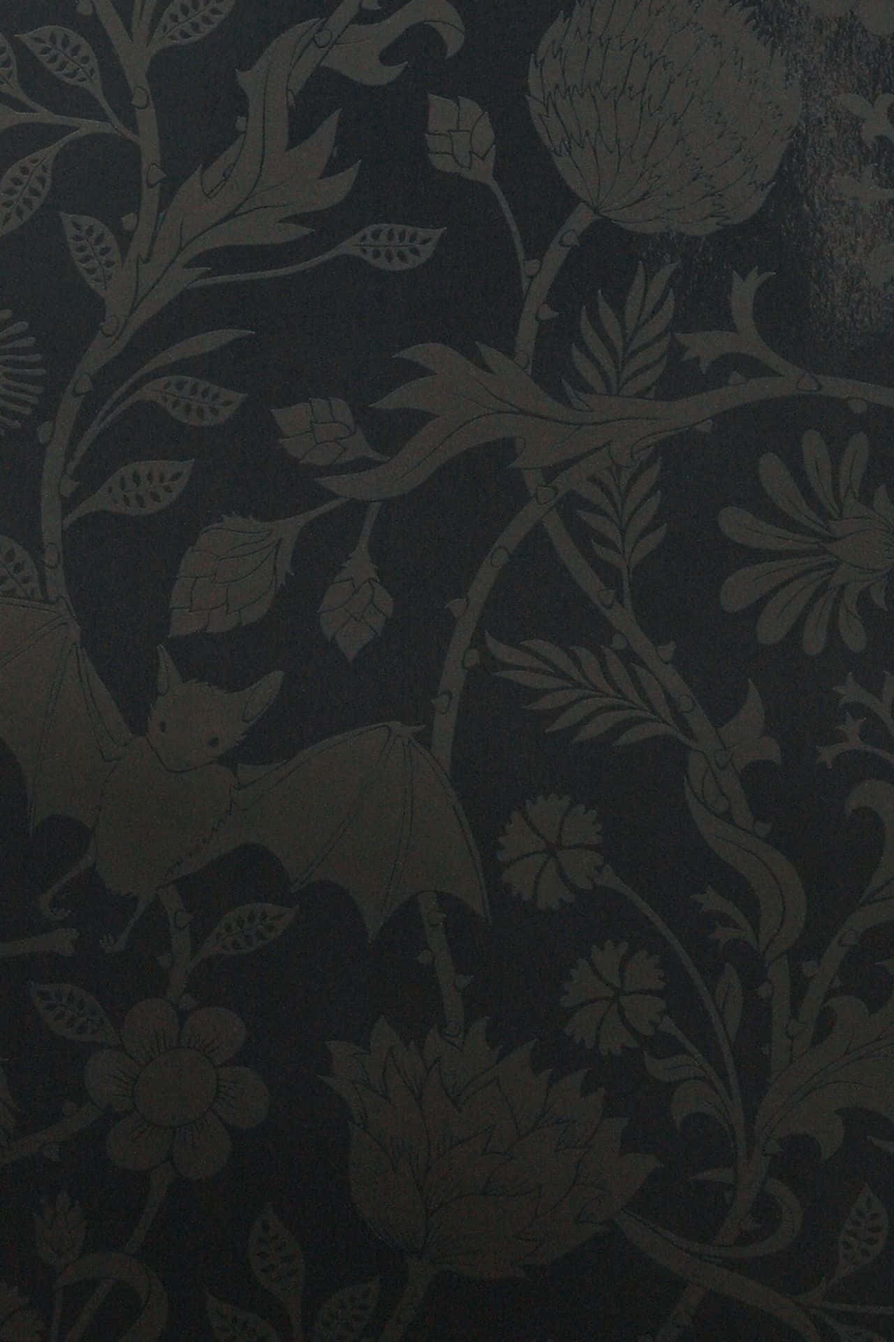 A Black Wallpaper With A Floral Pattern Background
