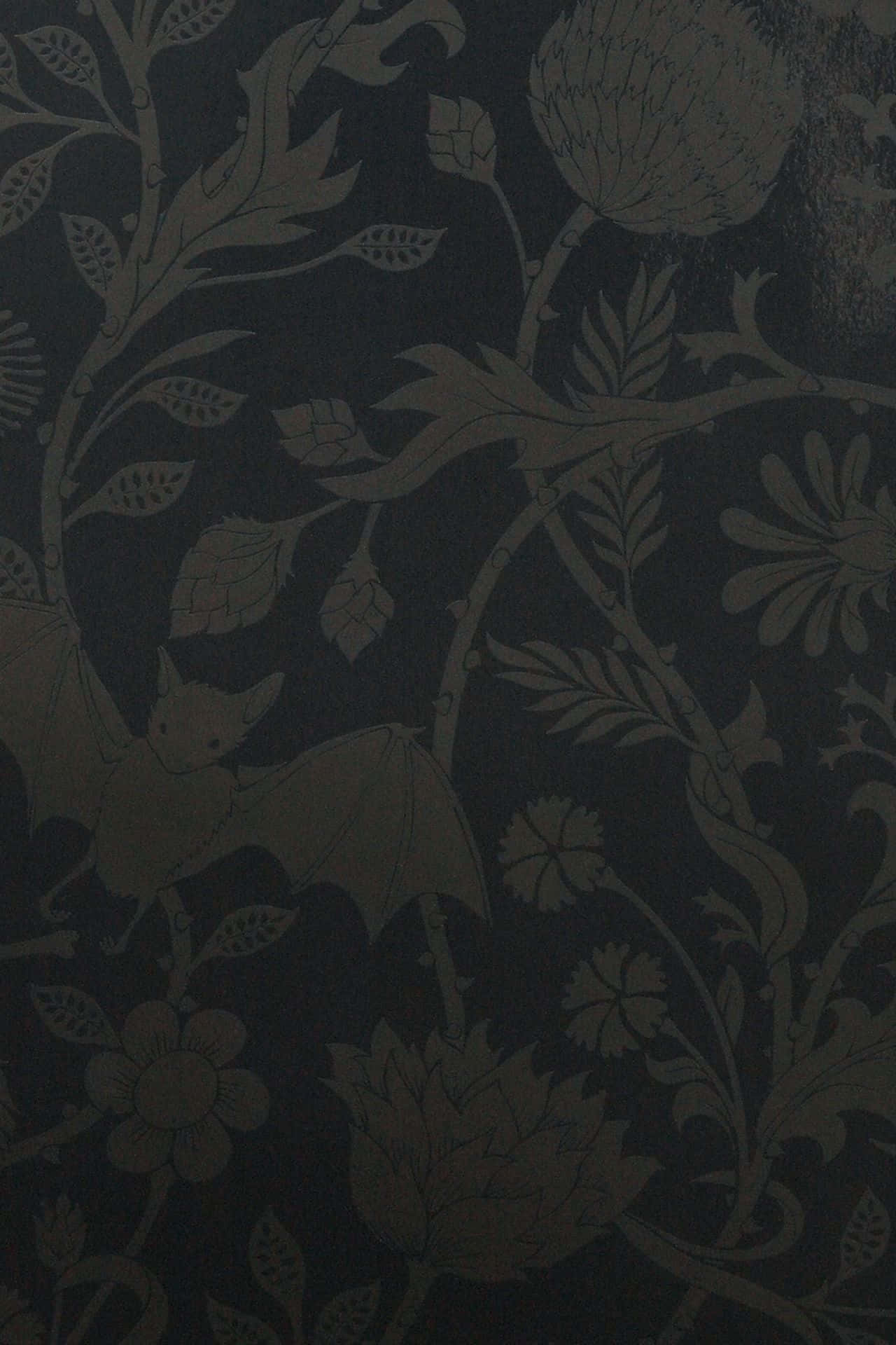 A Black Wallpaper With A Floral Pattern