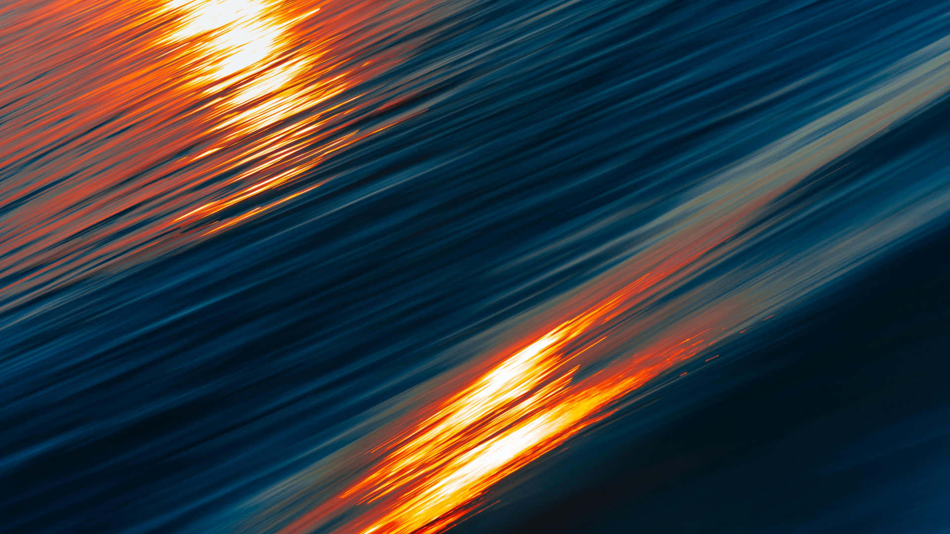 A Blue And Orange Sunset Background