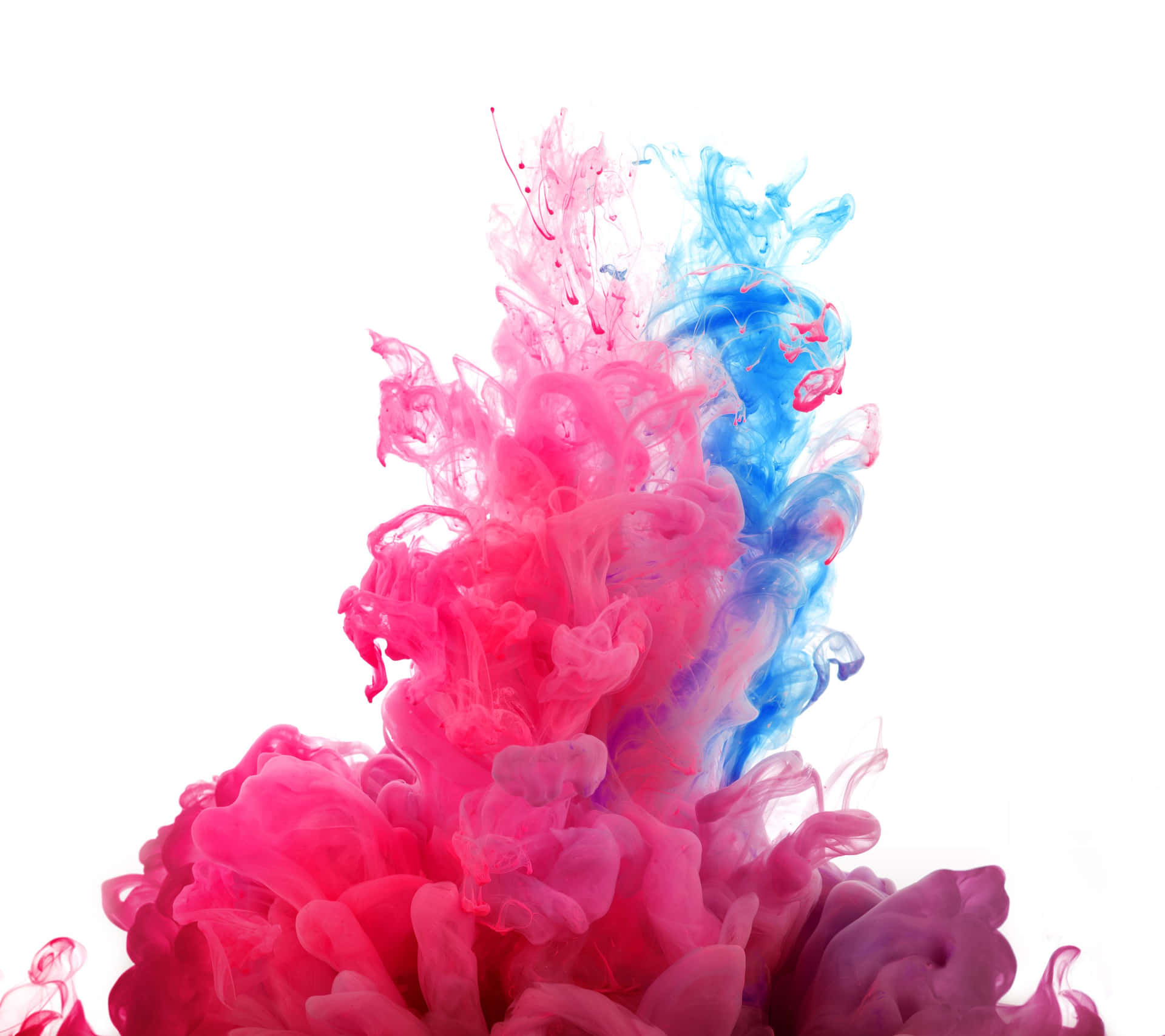A Blue And Pink Ink Is Floating In The Air