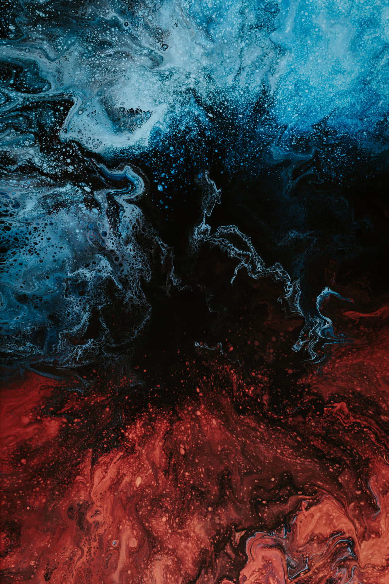 A Blue And Red Liquid With A Black Background