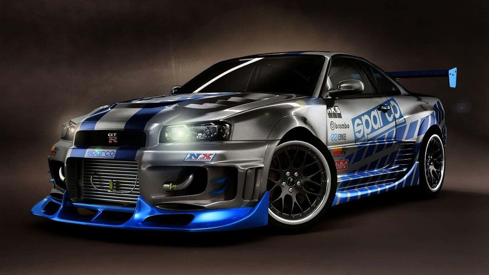 A Blue And Silver Car With Lights On It Background