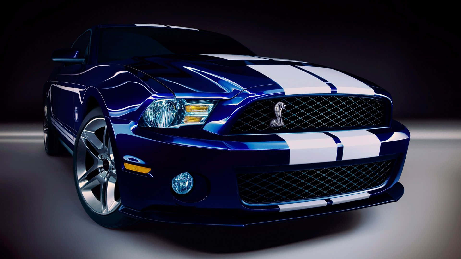 A Blue And White Ford Mustang Is Shown In A Dark Room Background