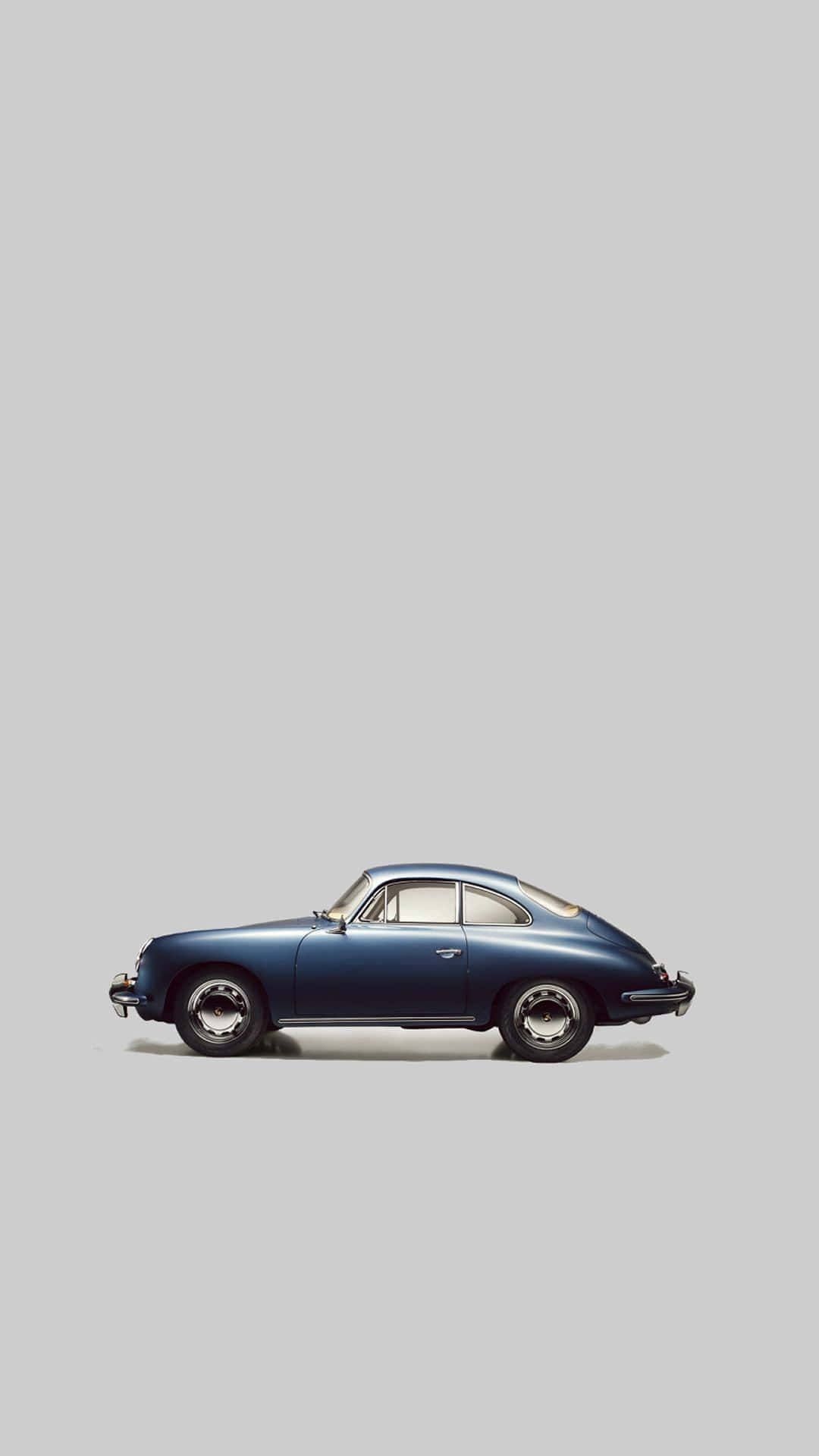 A Blue Car Is Shown Against A Gray Background Background