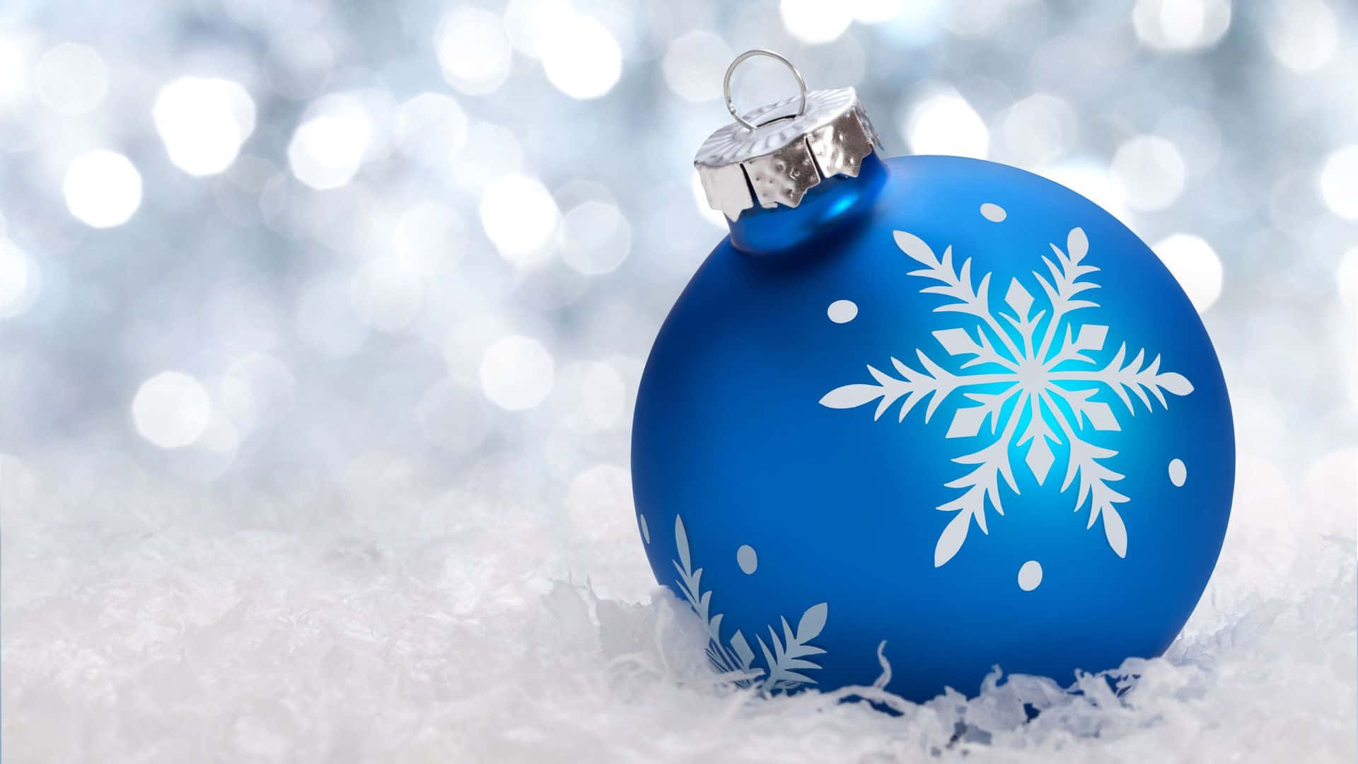 A Blue Christmas Ball With Snowflakes On It Background
