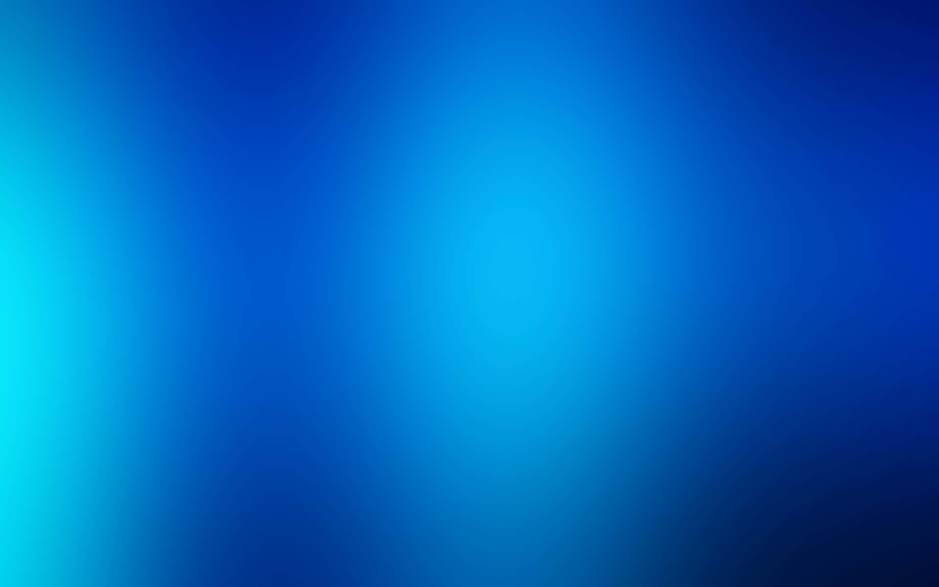 A Blue Desktop Illuminated With Natural Light Background