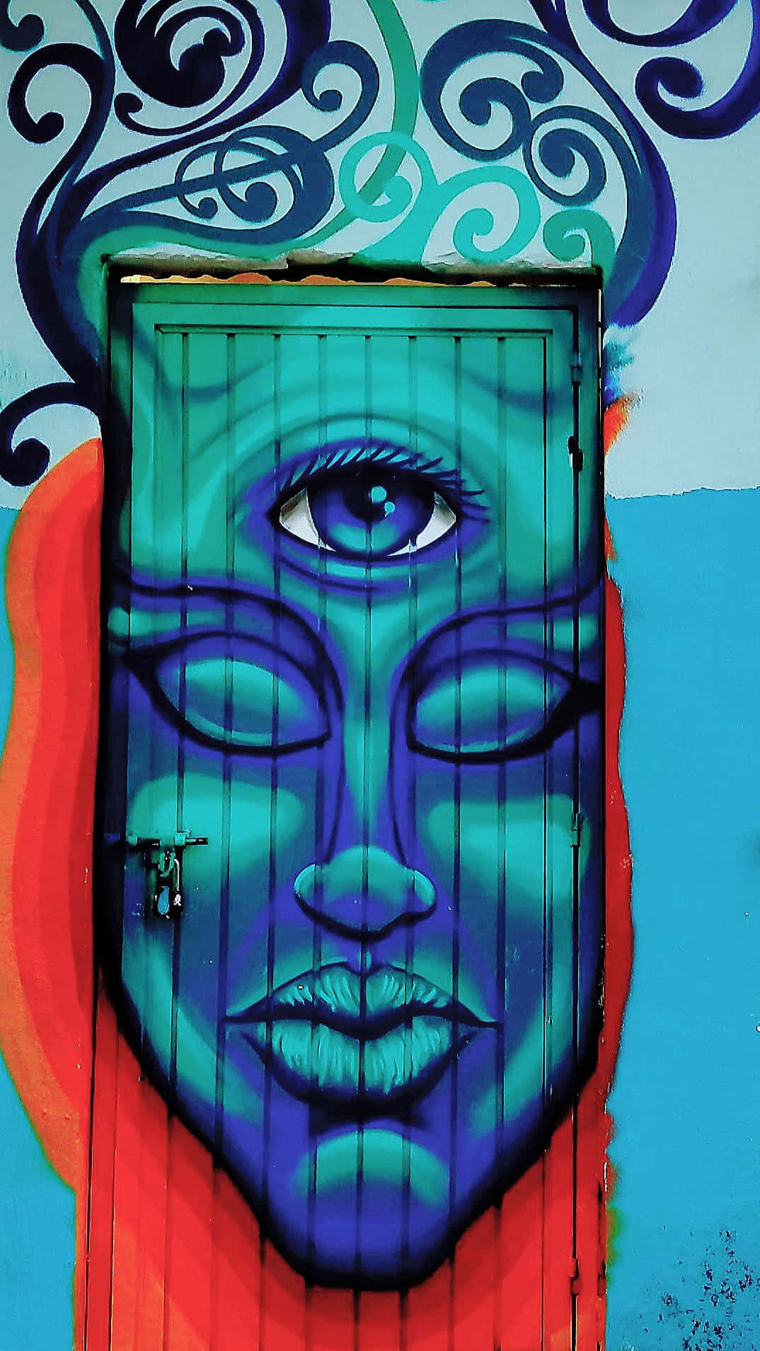 A Blue Door With A Blue Face On It Background