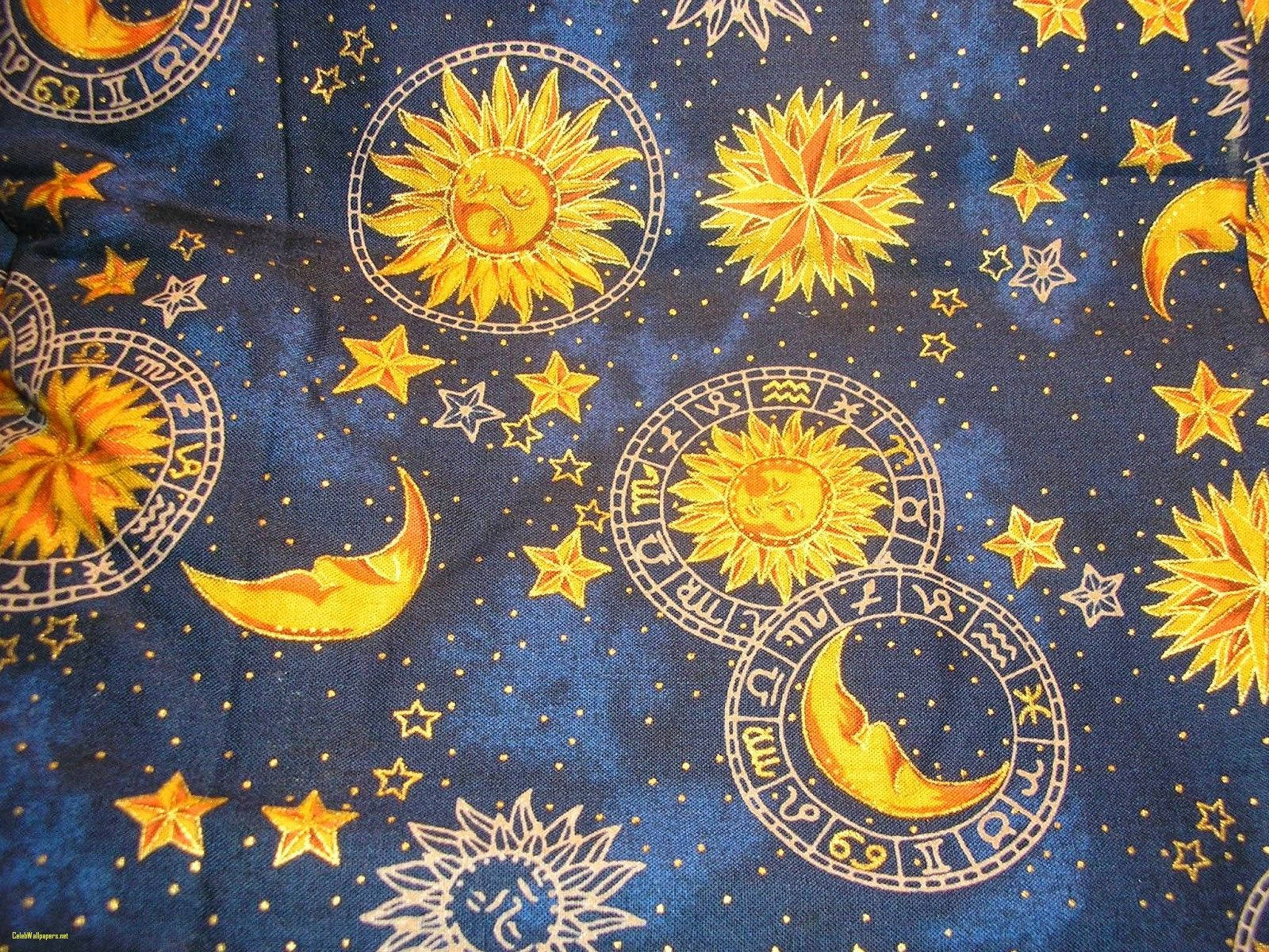 A Blue Fabric With Sun, Moon And Stars On It Background