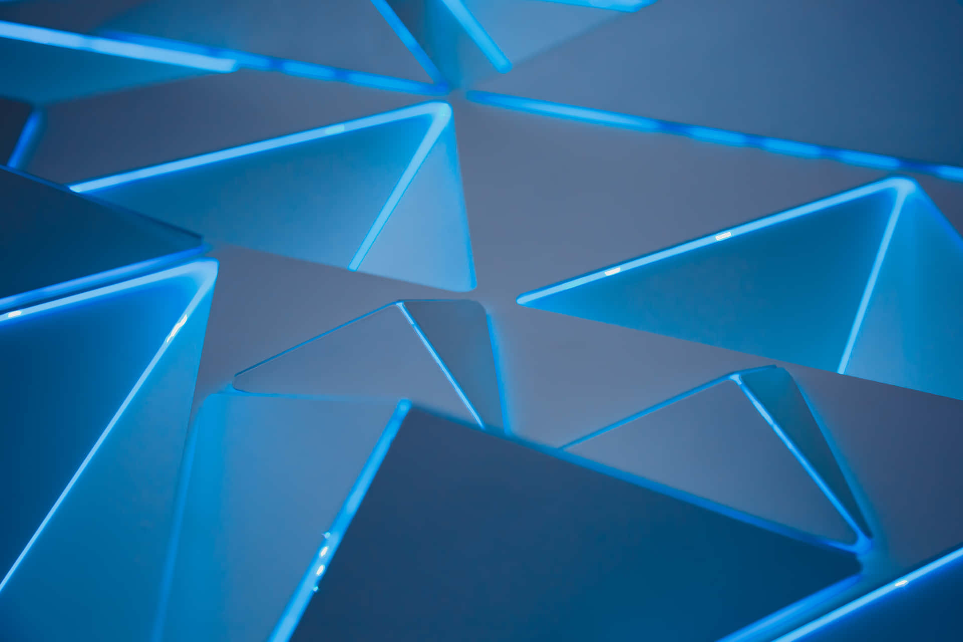 A Blue Light Is Shining On A Blue Geometric Pattern Background