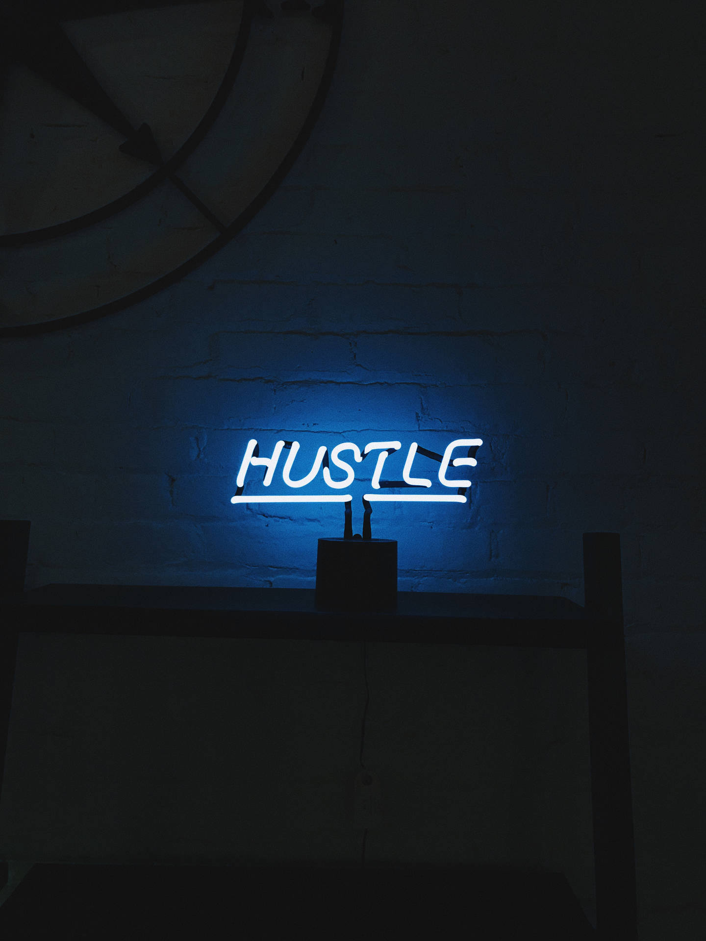 A Blue Neon Sign With The Word Hustle On It Background