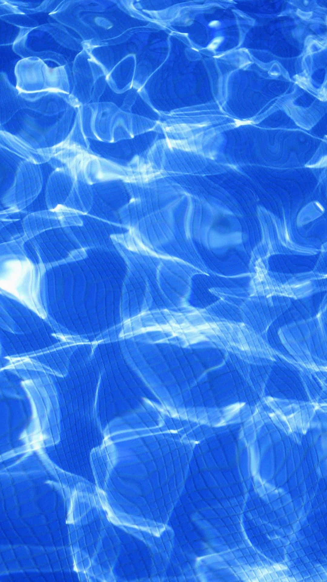 A Blue Pool With Ripples In The Water Background