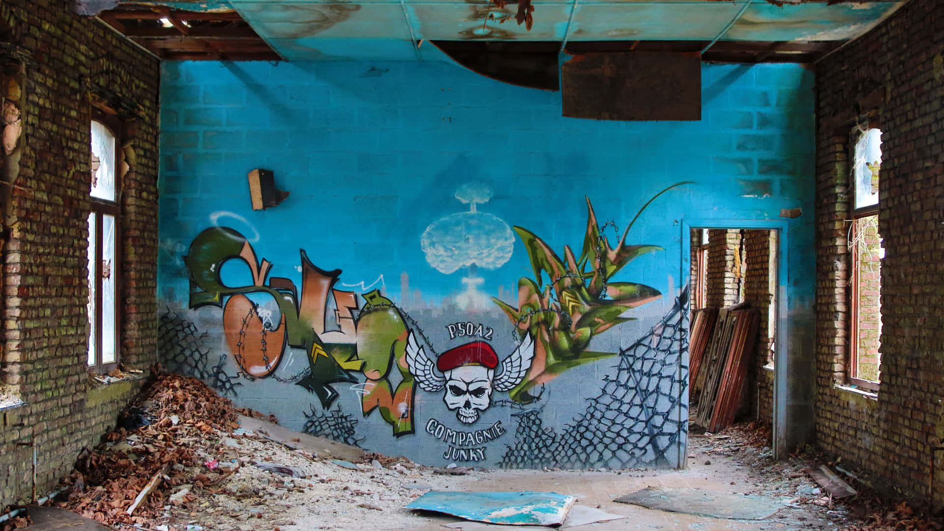 A Blue Room With Graffiti On The Walls