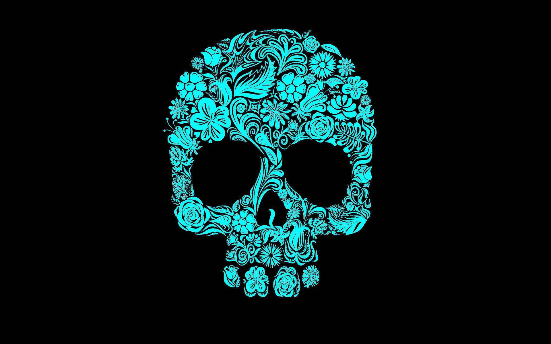 A Blue Skull With Floral Designs On A Black Background Background