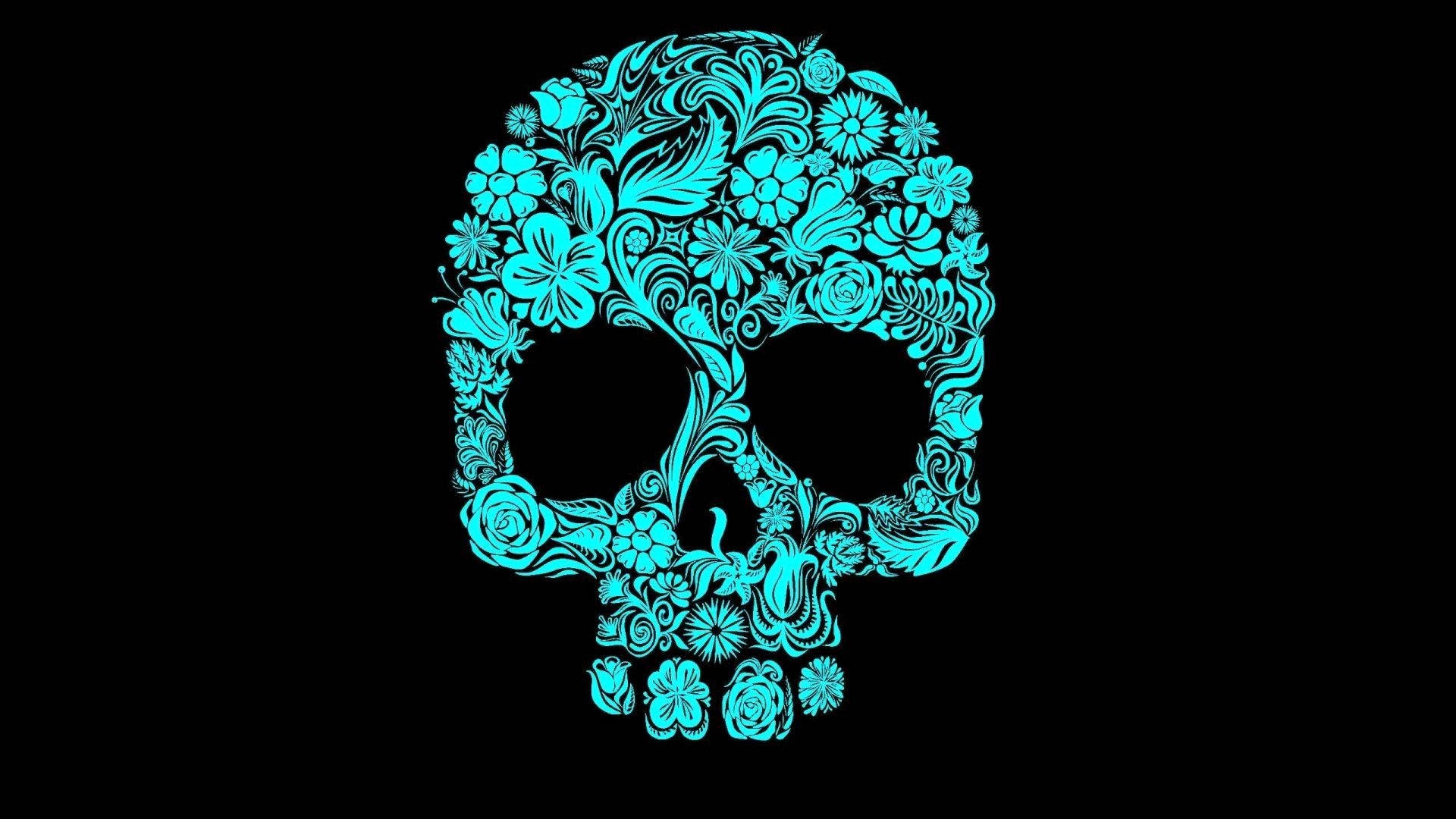 A Blue Skull With Floral Designs On A Black Background Background