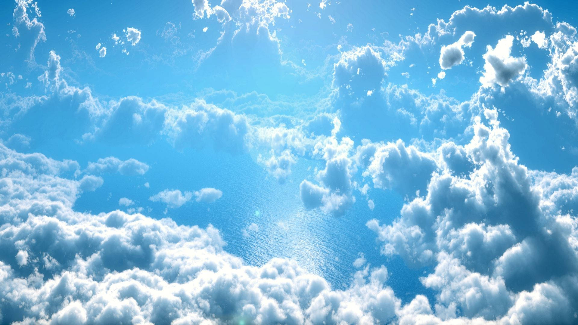 A Blue Sky With Clouds And Sun Background
