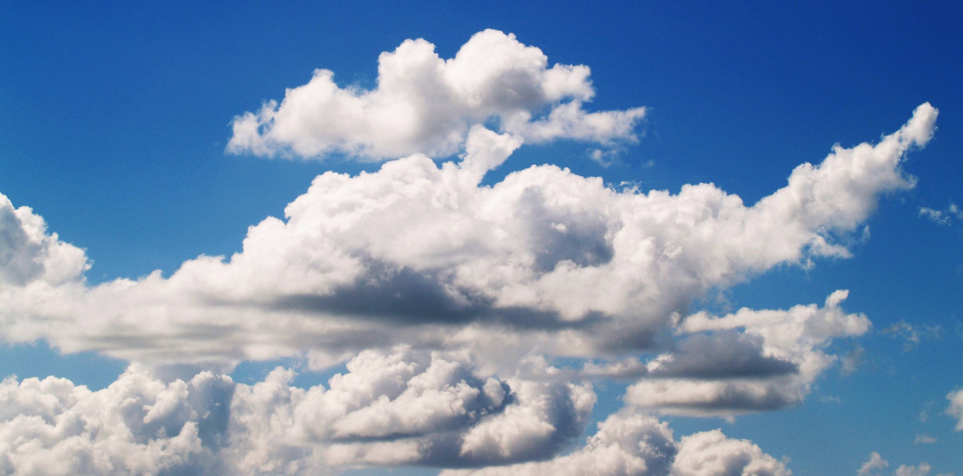 A Blue Sky With White Clouds Background