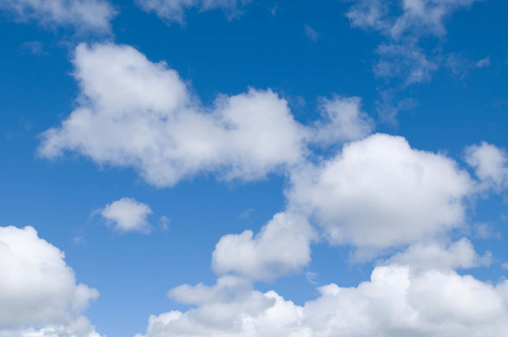 A Blue Sky With White Clouds Background