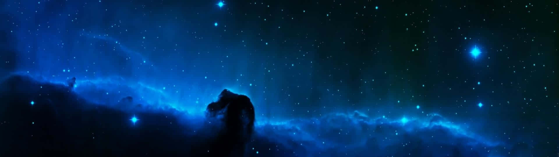 A Blue Space With Stars And Nebulas Background