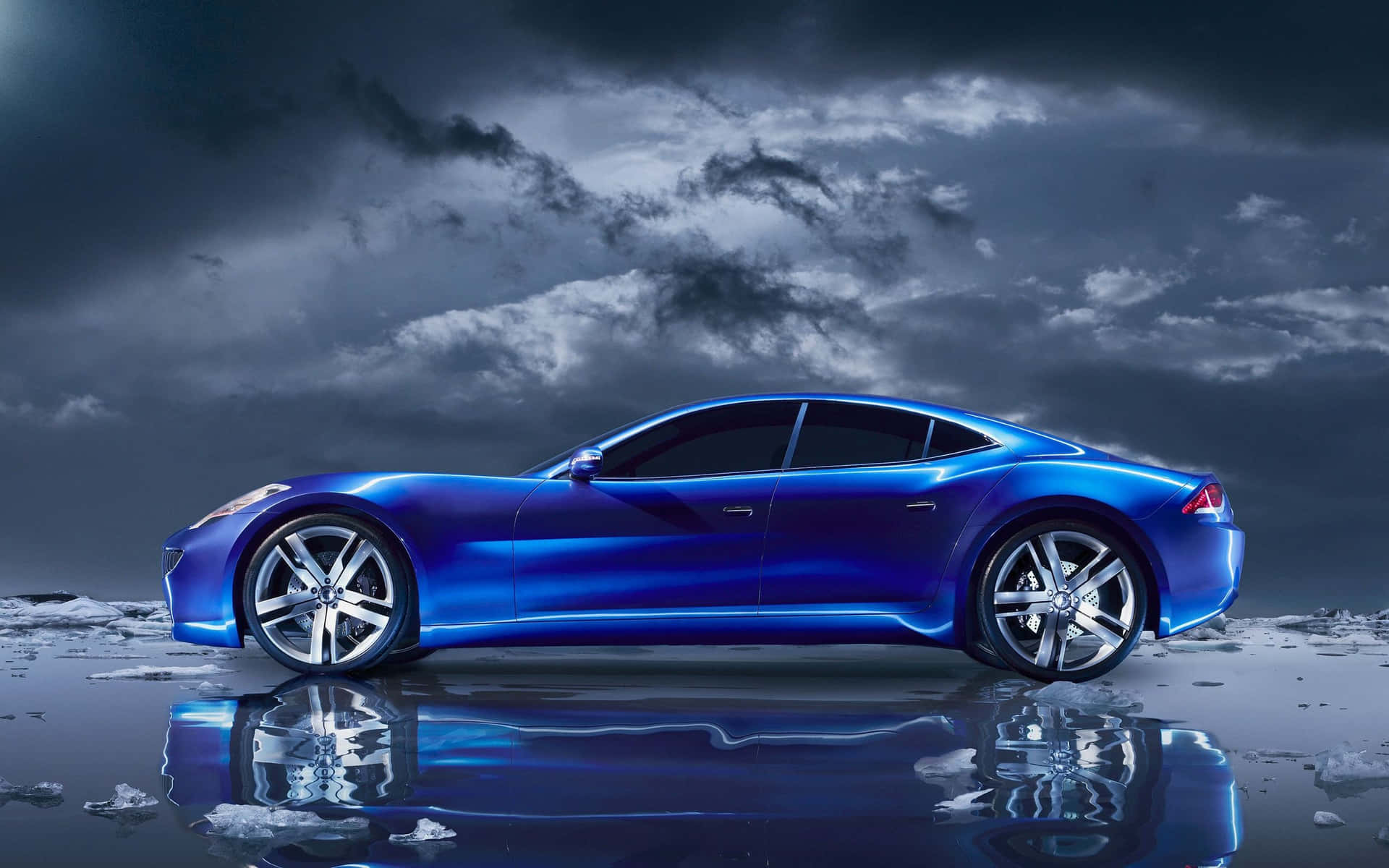 A Blue Sports Car Is Parked On Ice In The Water Background