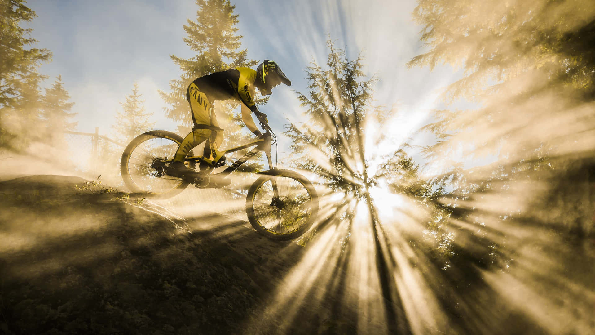 A Bmx Stunt Rider Catching Air At A Skatepark. Background