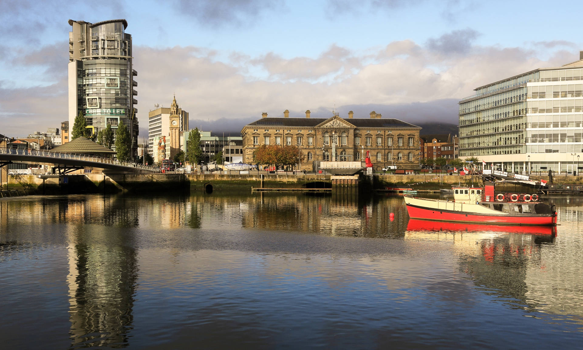 A Boat Is Floating In A River Background