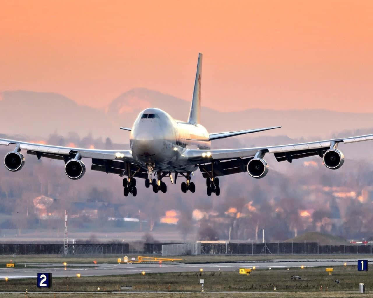 'a Boeing 747 Airplane Taking Off Against A Blue Sky' Background