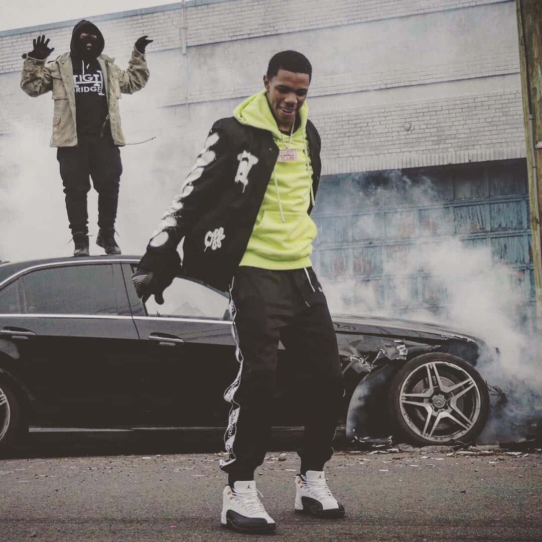 A Boogie Wit Da Hoodie Performs Onstage At An Energy-filled Show Background